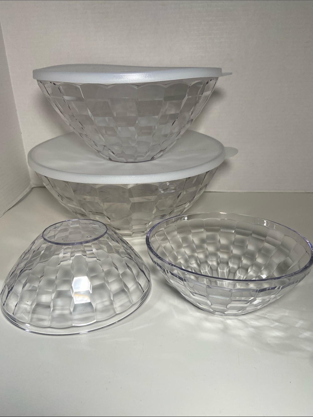 Tupperware Prisma or Diamond serving bowls with a modern, transparent design.